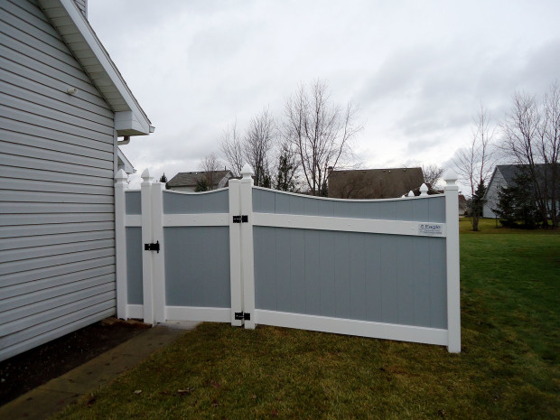 Gray vinyl Lakeland-style concave fence