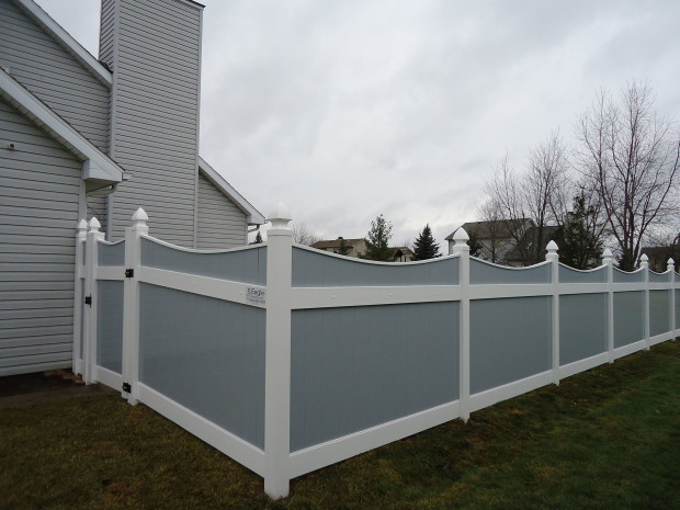 Gray vinyl Lakeland-style concave fence