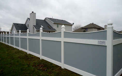 Gray vinyl Lakeland-style concave fence