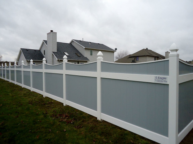 Gray vinyl Lakeland-style concave fence